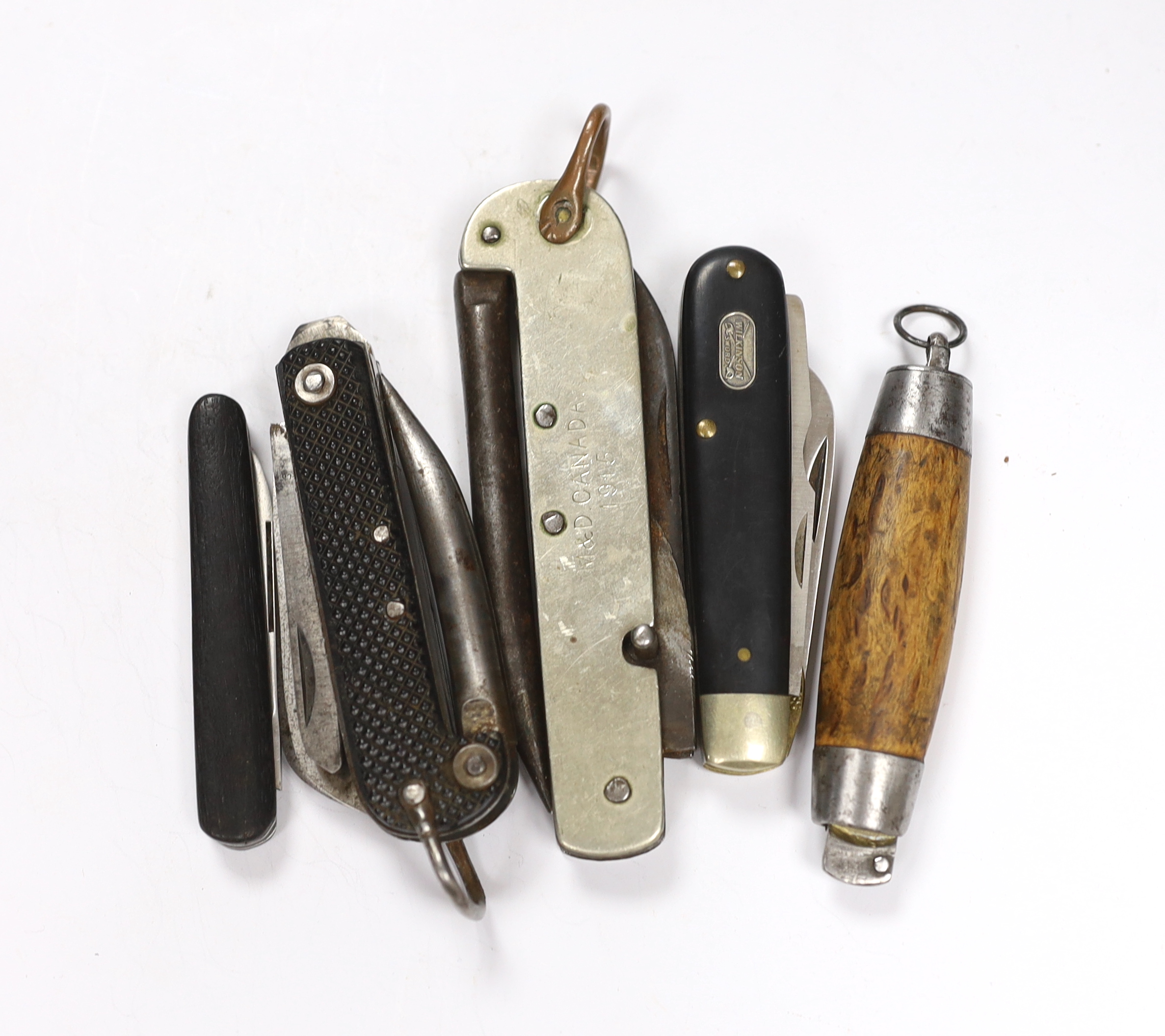 Five penknives including; a Canadian Army Militia & Defence ‘Utility Knife’ dated 1915, a British Military Clasp Knife by G. Ibberson & Co., 1942, a Swedish barrel knife with wooden grip and steel end caps, the brass sec